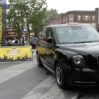 THE ELECTRIC TAXI ARRIVES AT KINGS CROSS STATION